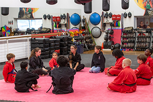 why_choose_us-4a Douvris Bank Street students sitting around talking about word of the month