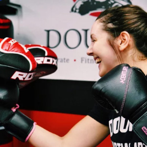 fitness kickboxing in Barrhaven, member wearing sparring gloves