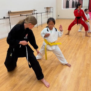 Teacher showing member technique at Douvris Ottawa-East